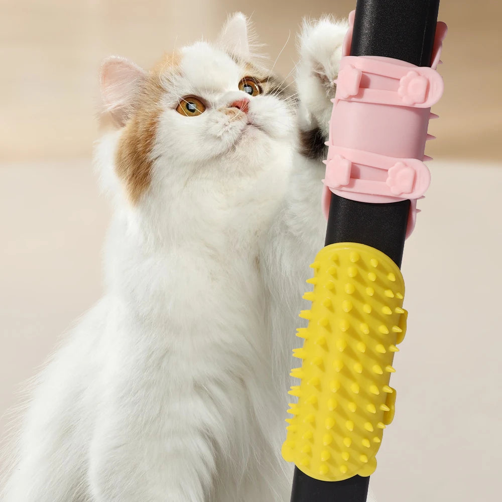 Yellow silicone self-grooming cat brush attached to a post for scratching, massage, and loose fur removal